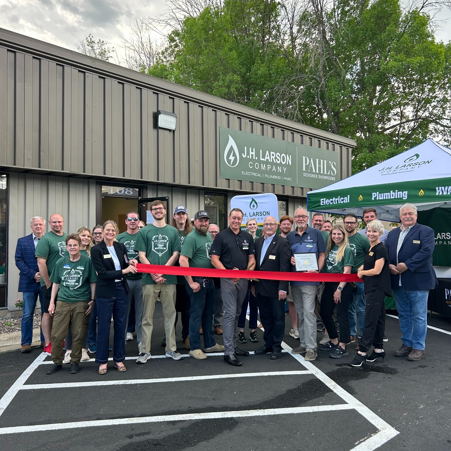 jh larson ribbon cutting rochester, mn